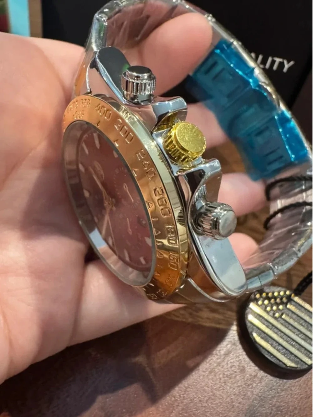 AJ watch, stainless steel, gold & silver toned, crimson red face